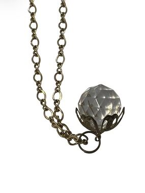 Clear Faceted Ball set in Gold Tone setting on Gold Tone Chain